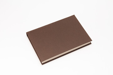 Brown color book on white background