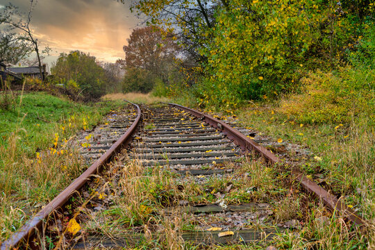 Railroad tracks with a dramatic sunset in the background. Picture from Scania county, Sweden