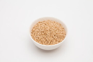 Brown rice, unpolished rice in a white bowl