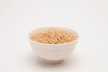 Brown rice, unpolished rice in a white bowl
