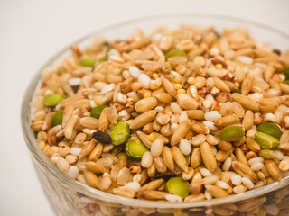Close up of Miscellaneous grains in transparent glass cup isolated