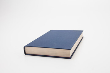 Dark blue book on white background