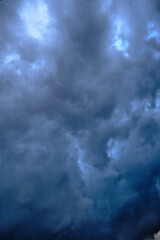 Naklejka na ściany i meble Dark ominous grey storm clouds.