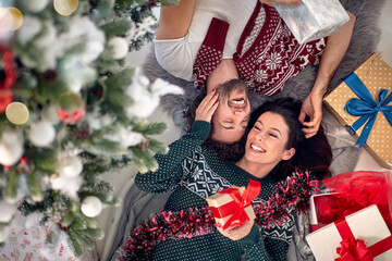 Happy couple sharing gifts on Chrismas morning