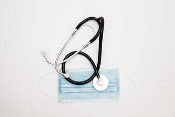  Surgical Mask and stethoscope on the white background