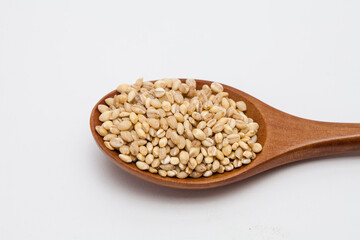 Wooden spoon with brown rice unpolished rice