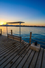 Naklejka na ściany i meble Wooden Pier on Red Sea in Hurghada at sunset, View of the promenade boardwalk - Egypt, Africa