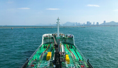 Landscape, on ship deck shot of oil tanker ship fully load with safety equipment. With clear blue...
