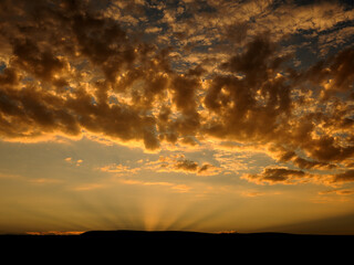 Dramatic light reflection against clouds with sunset in the Namib Desert