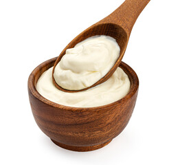 Sour cream in wooden spoon isolated on white background