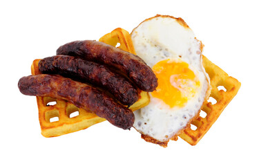 Grilled pork sausages and fried egg on a potato waffle isolated on a white background
