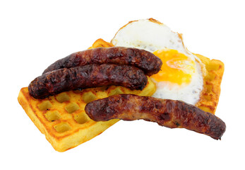 Grilled pork sausages and fried egg on a potato waffle isolated on a white background