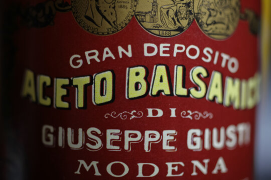 Viersen, Germany - May 2. 2020: Closeup of italian bottle label red aceto balsamico vinegar