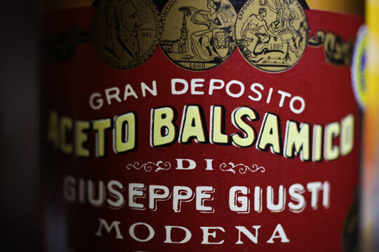 Viersen, Germany - May 2. 2020: Closeup of italian bottle label red aceto balsamico vinegar