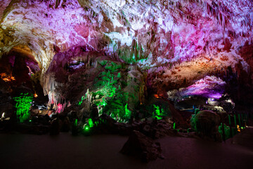 Fototapeta na wymiar illuminated cave in different colors