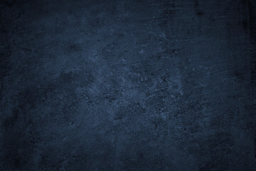 Dark grunge background. Black blue abstract rough background. Toned concrete wall texture.