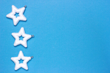 Fototapeta na wymiar christmas background with white stars on a blue background, delicate christmas card