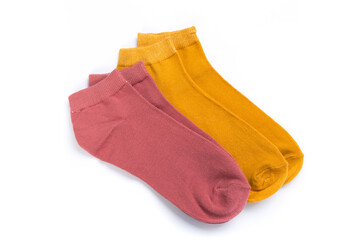two pairs of colored short socks on a white background, top view