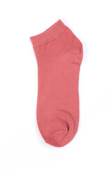 one pink short sock on a white background, top view