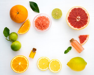 Top view of citrus fruits on white wooden background. Ingredient of punch and cocktail drink. Mix fresh citrus fruits Lemon, orange lime,mandarin,grapefruit. in fresh and colourful fruits concept. 