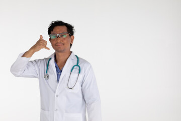 Fototapeta premium Asian medical doctor wearing gown and stethoscope standing on white background copy space isolated.