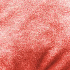 Red velvet background or velour flannel texture made of cotton or wool with soft fluffy velvety satin fabric cloth rose gold metallic color material