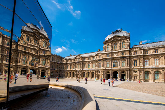 Reflections of the Cour Carree courtyard in the Lourve, Paris, France