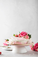 Obraz na płótnie Canvas Birthday party concept with rose white cake