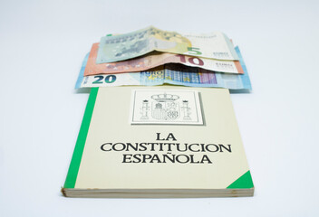 Euro banknotes with the Spanish constitution and white background
