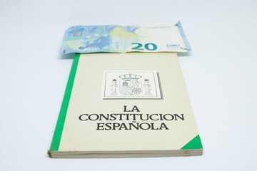 Euro banknotes with the Spanish constitution and white background