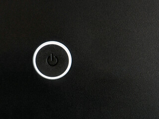 Power button. Turn on, turn off on black background.