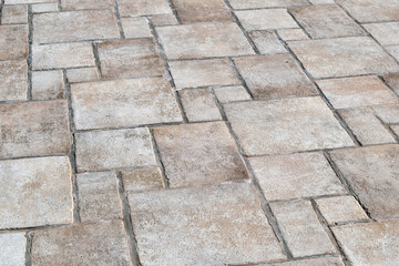 Close Up of Smooth Pavement with Textured Pattern of Stones 