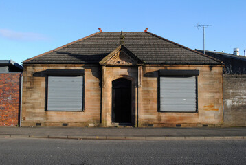 Old Victorian Stone Office Building with Classical Entrance & Steel Roller Shutters  