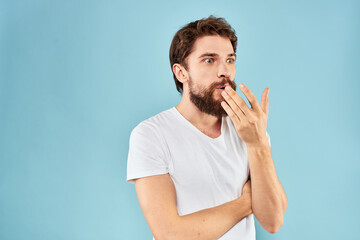 Cheerful man gesturing with his hands emotions cropped view on blue background studio