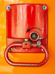 Red emergency break on orange ground