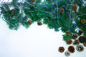 Christmas composition on a white isolated background with cones, fir branches, Christmas toys, balls. Copy space for your congratulations.Eco natural frame.  New year Holidays concept as top view.