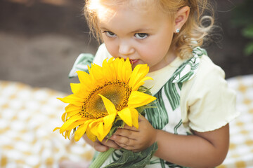 Cute little girl closeup portrait on summer background.