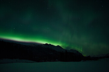 Aurora over Alaska mountains