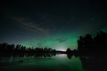 Aurora over river in Alaska.