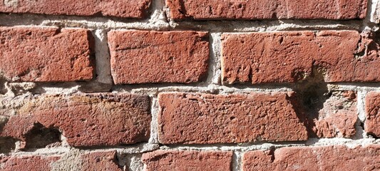 Backgrounds and textures of old broken red bricks.