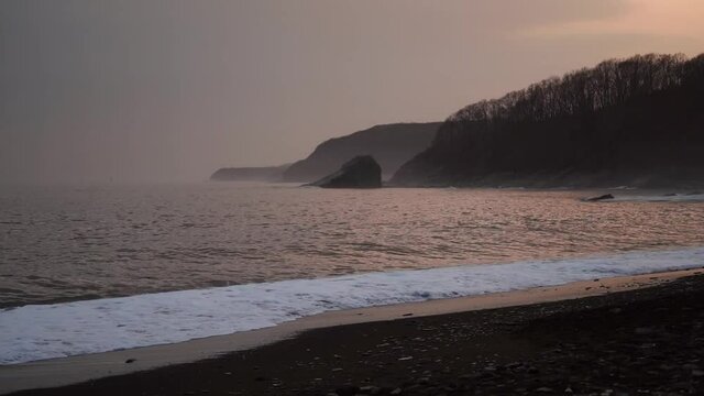 Seascape with beautiful rocks and waves. Glass beach, Vladivostok