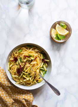 Spaghetti with zucchini and smoked ham