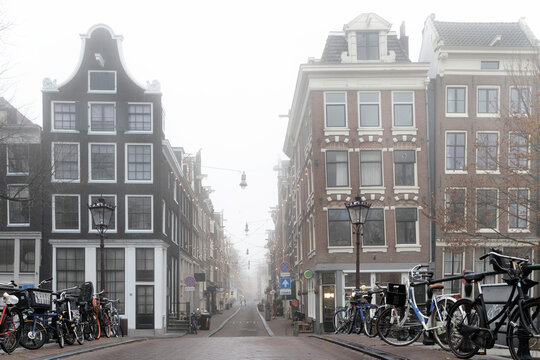 amsterdam street on a grey, misty day