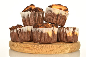 Several fragrant chocolate curd muffins, close-up, isolated on white.