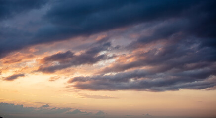 Sunrise clouds. Dramatic magical sunset over orange cloudy sky