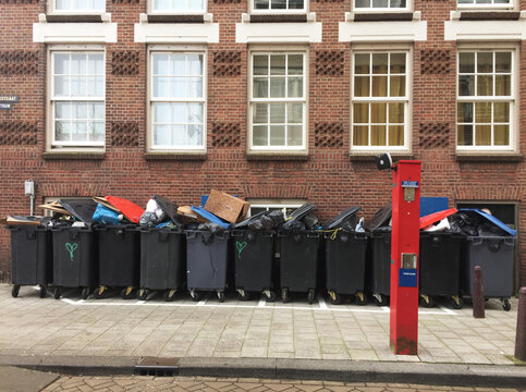 row of containers with garbage