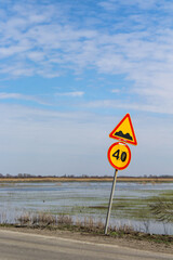 Road sign. Rough road. Speed Limit