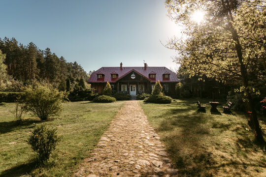 Exterior of old mansion in spring sunlight - Powered by Adobe