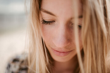 Young sad pensive blonde woman