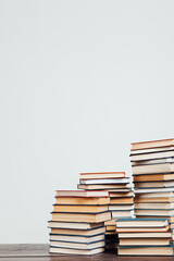 many stacks of educational books to study in the university library as a background